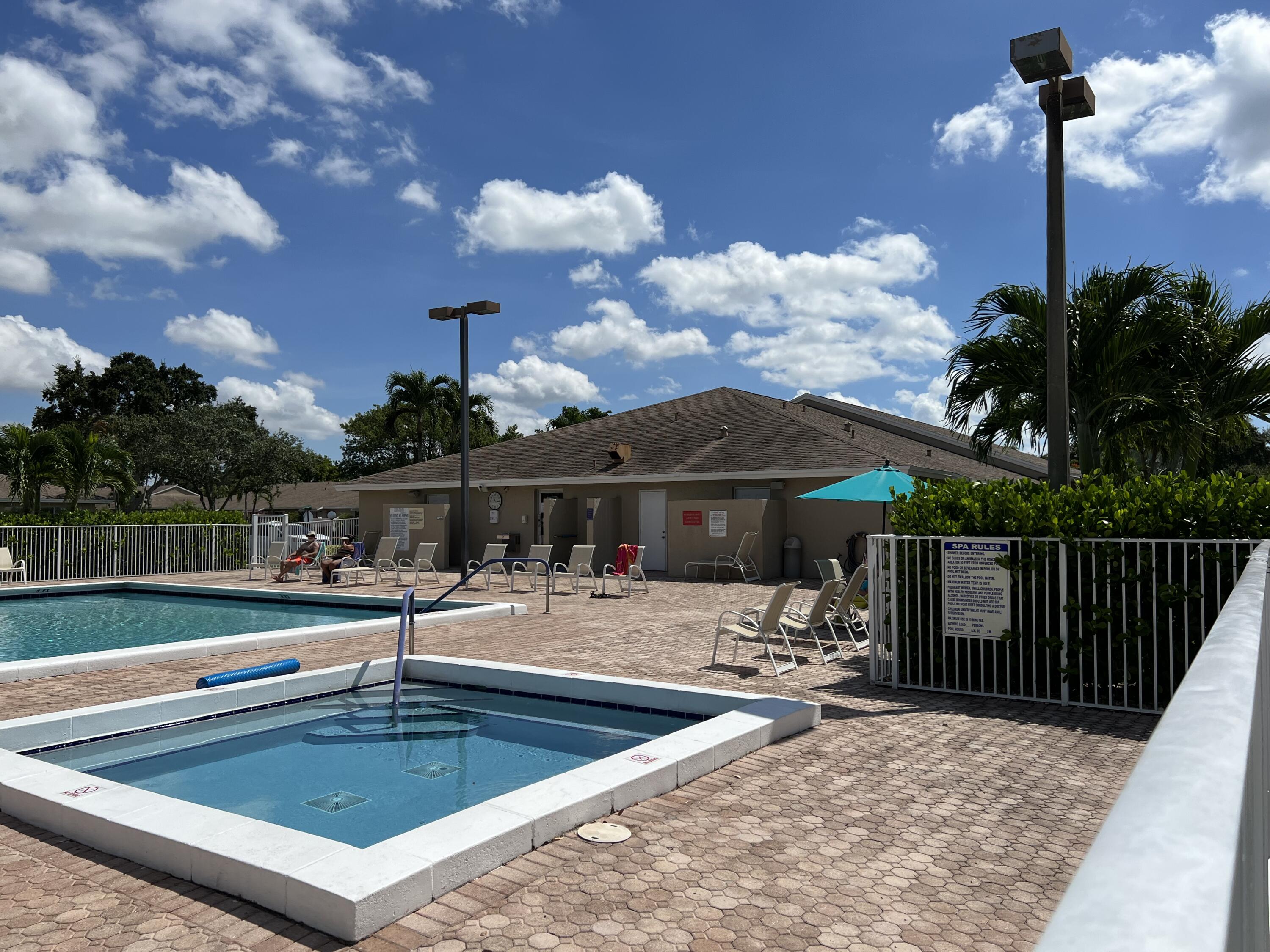 8916 Rheims Road Boca Raton, FL 33496 - Photo 31 of 31 a view of a house with swimming pool and sitting area