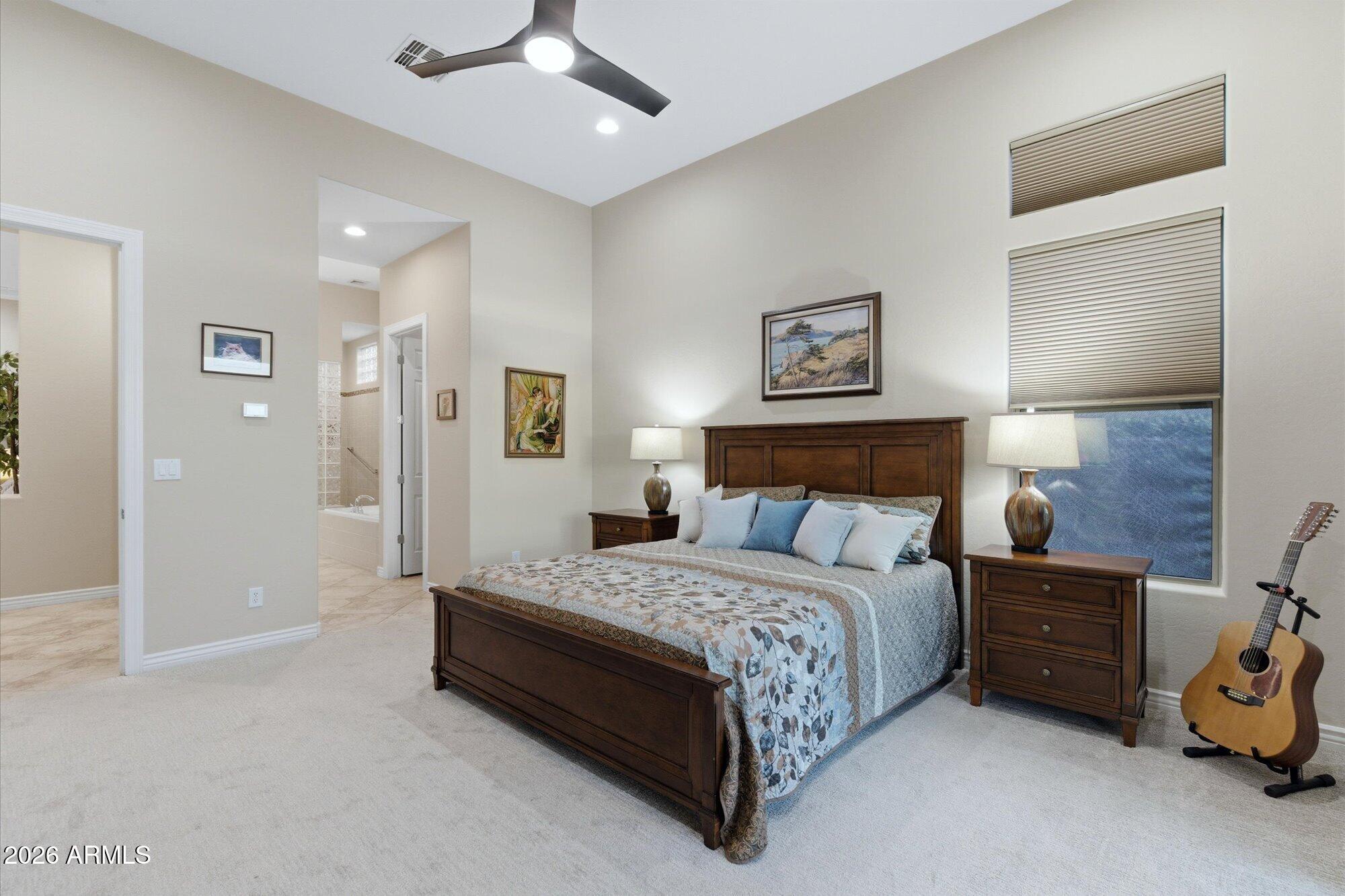 40322 North Hawk Ridge Trail Anthem, AZ 85086 - Photo 26 of 63 a bedroom with a bed and a walk in closet