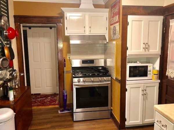 130 Copperfield Road Worcester, MA 01602 - Photo 23 of 32 a kitchen with granite countertop a stove and a refrigerator