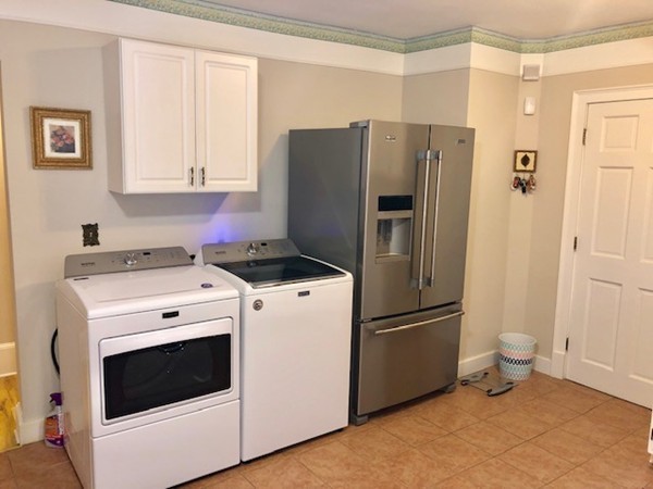 130 Copperfield Road Worcester, MA 01602 - Photo 5 of 32 a kitchen with a refrigerator sink stove and cabinets