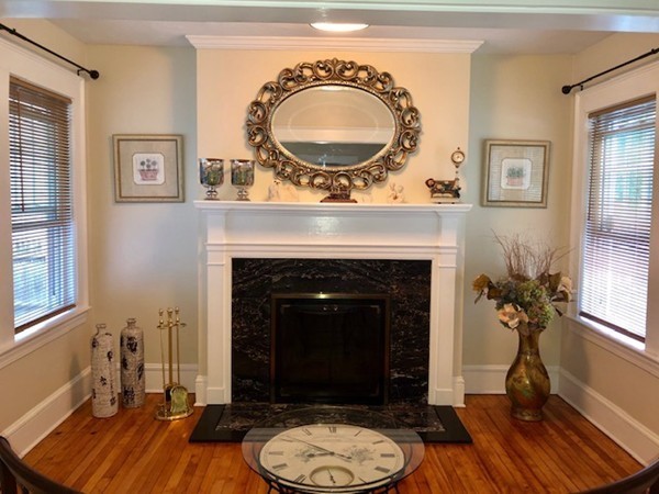 130 Copperfield Road Worcester, MA 01602 - Photo 8 of 32 a living room with a fireplace wooden floor and a fireplace