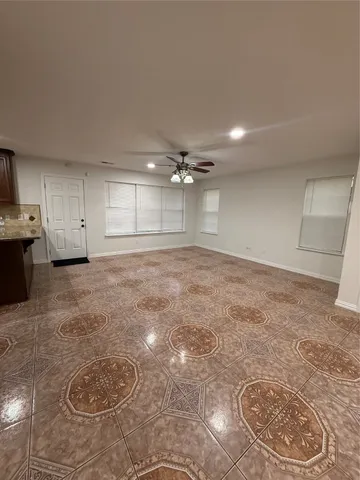 a view of a livingroom with a kitchen