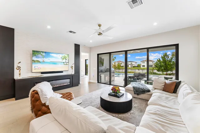 a living room with furniture and a large window
