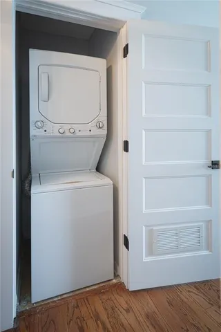 a bedroom with a bed a table and chairs