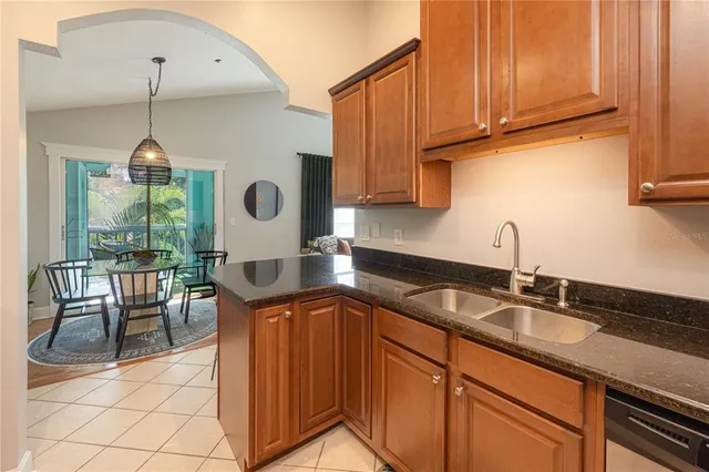 a kitchen with stainless steel appliances granite countertop a stove microwave and cabinets