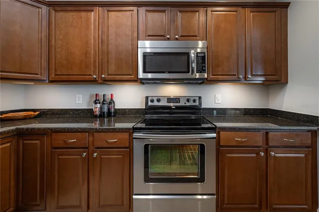 a balcony with furniture and a potted plant