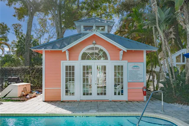 a front view of a building with trees