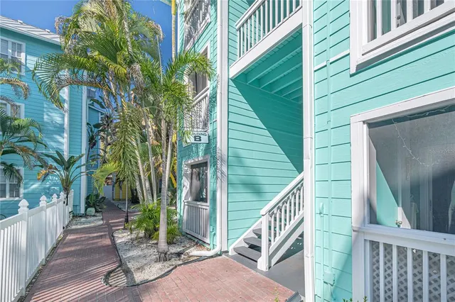 a vase of flowers sitting on a floor