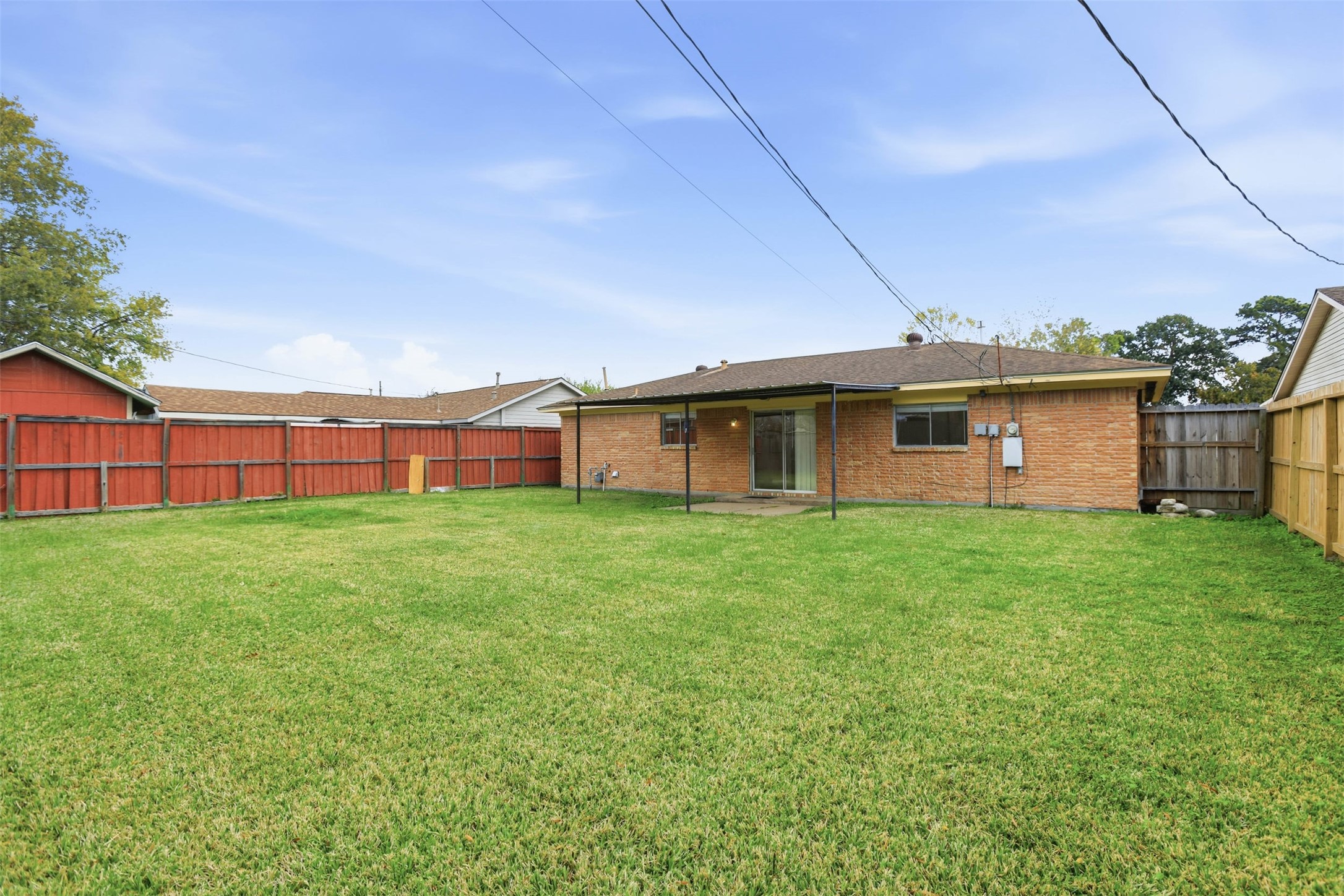 827 Parkhill Street Channelview, TX 77530 - Photo 25 of 26 a view of a house with a backyard