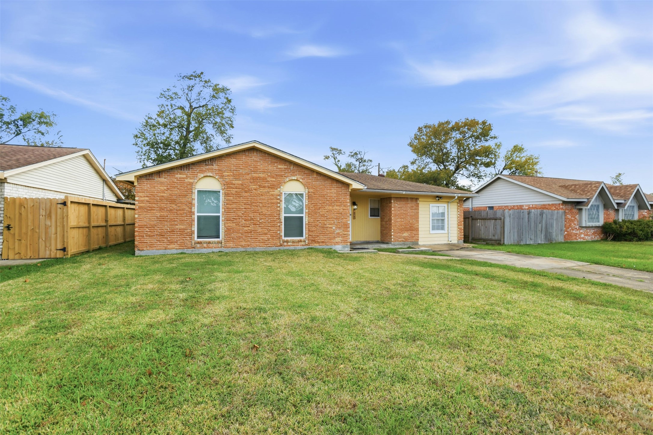 827 Parkhill Street Channelview, TX 77530 - Photo 3 of 26 a front view of a house with a garden