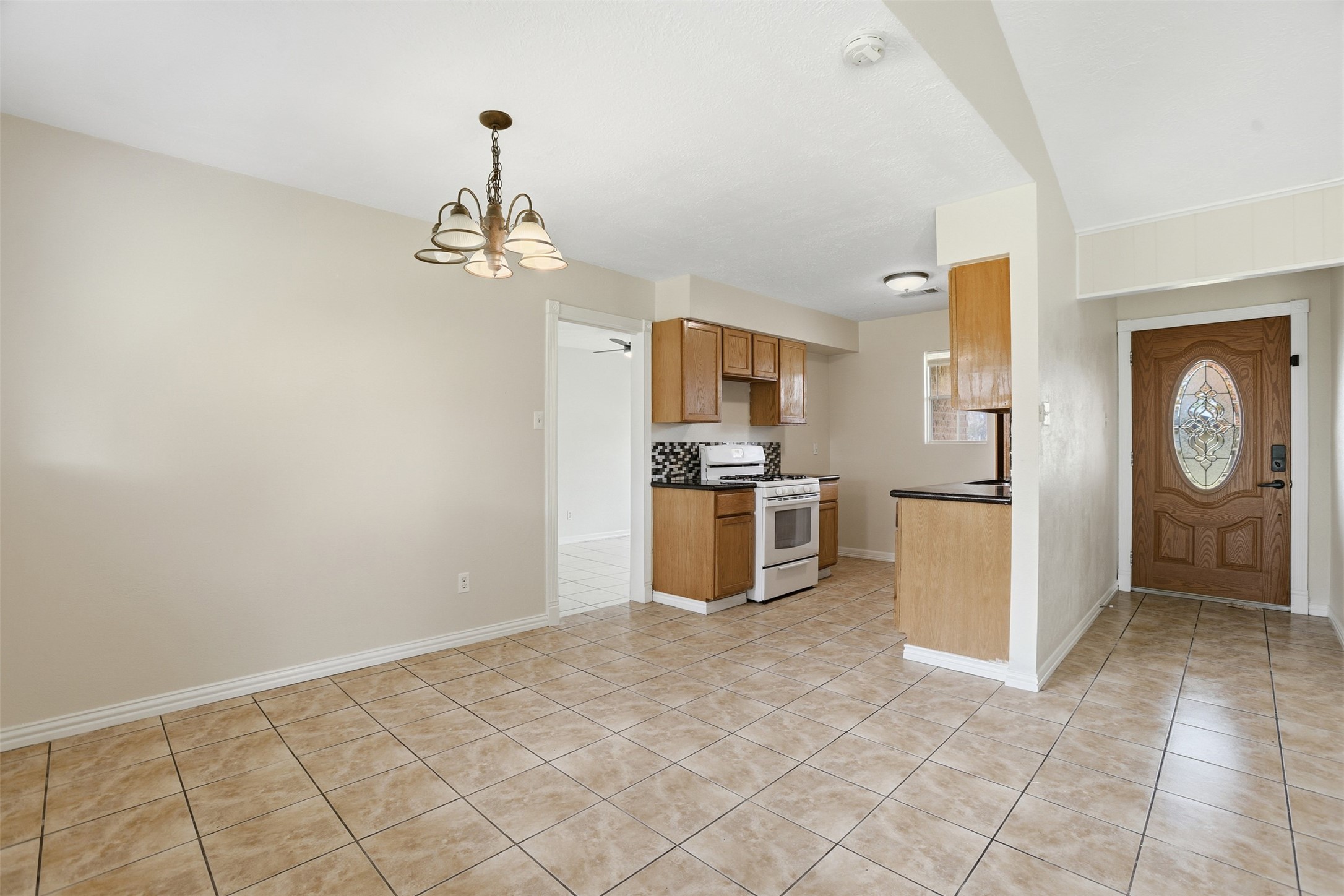 827 Parkhill Street Channelview, TX 77530 - Photo 6 of 26 a kitchen with stainless steel appliances granite countertop a refrigerator and a sink