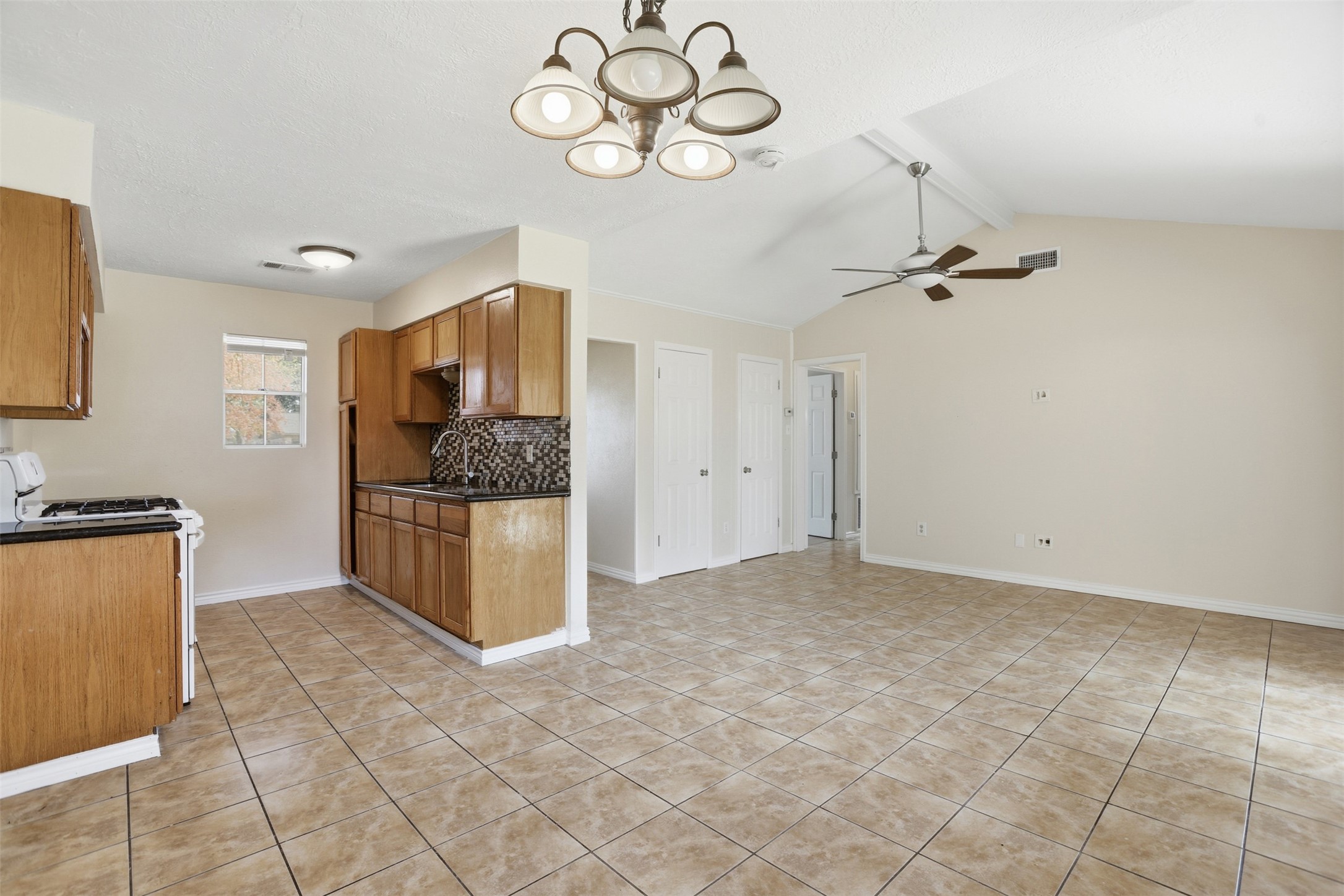 827 Parkhill Street Channelview, TX 77530 - Photo 7 of 26 a view of a kitchen with a sink cabinets and window