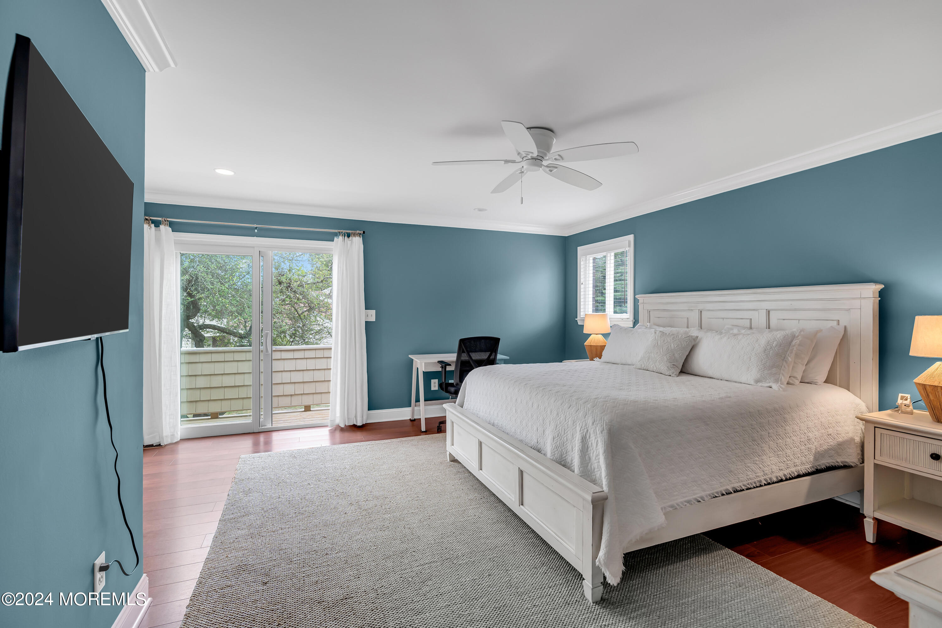 16 Spruce Lane Spring Lake Heights, NJ 07762 - Photo 18 of 31 a bedroom with a large bed and a chandelier