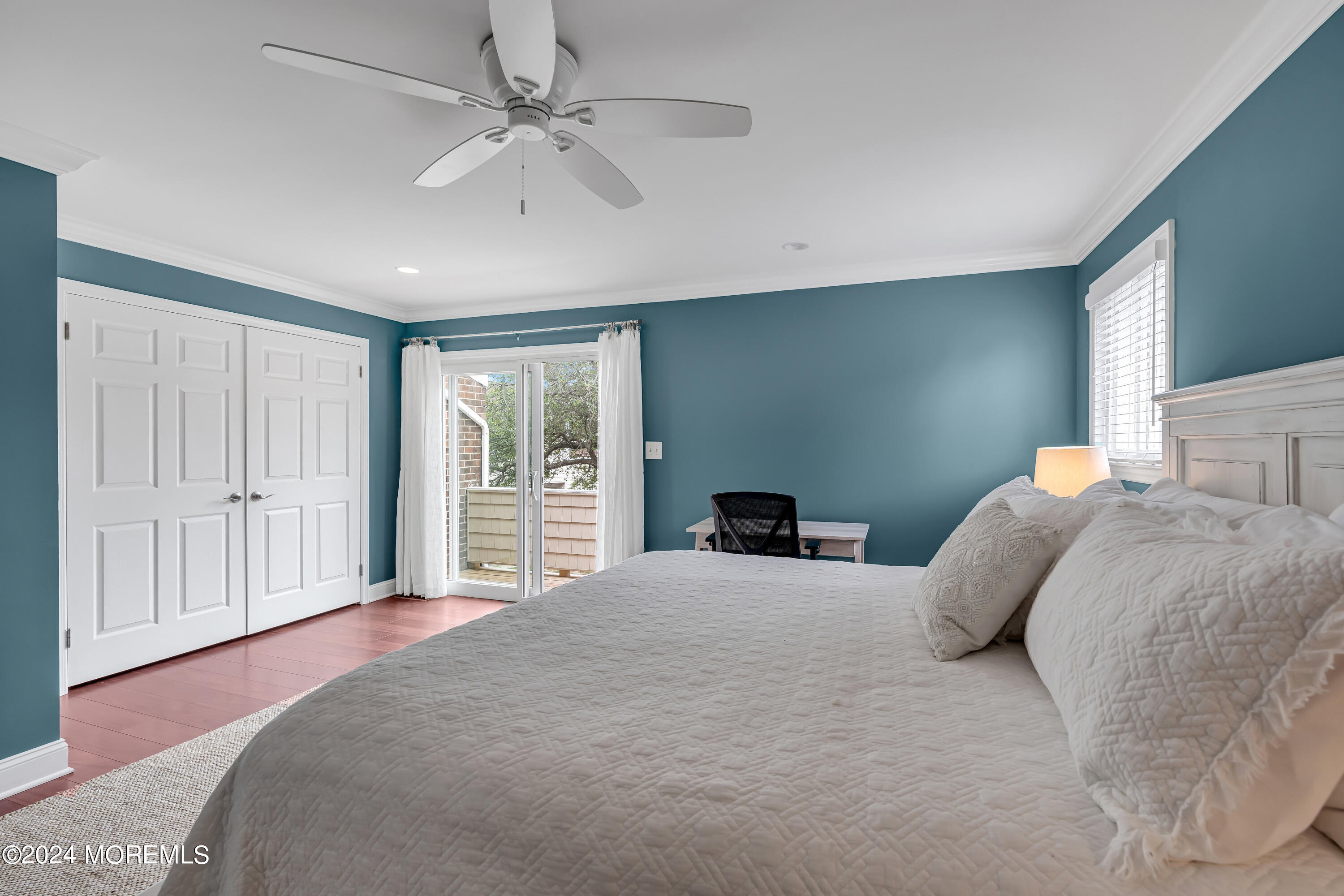 16 Spruce Lane Spring Lake Heights, NJ 07762 - Photo 19 of 31 a bedroom with a large bed and a chandelier