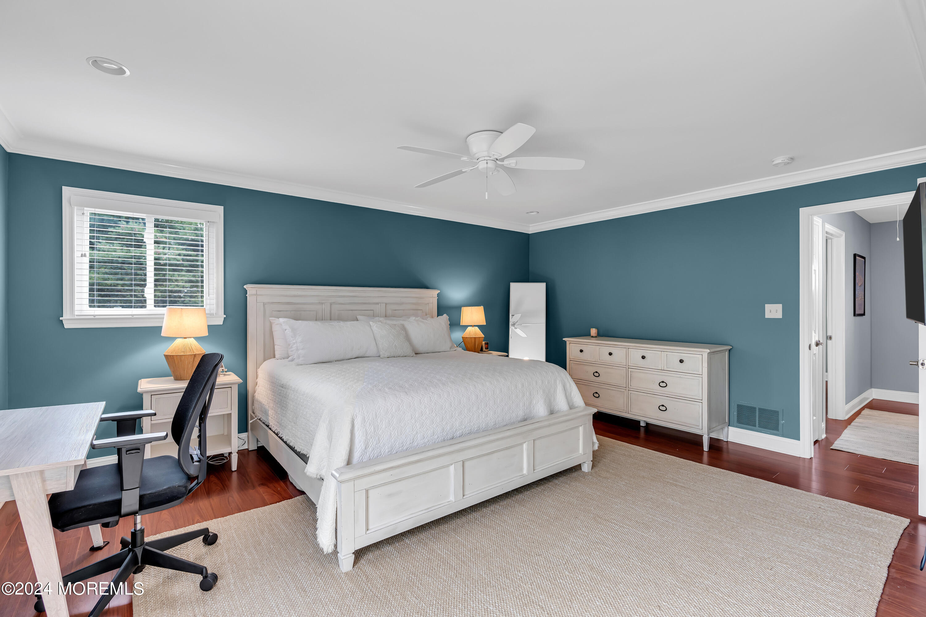 16 Spruce Lane Spring Lake Heights, NJ 07762 - Photo 21 of 31 a bedroom with a bed and a chandelier