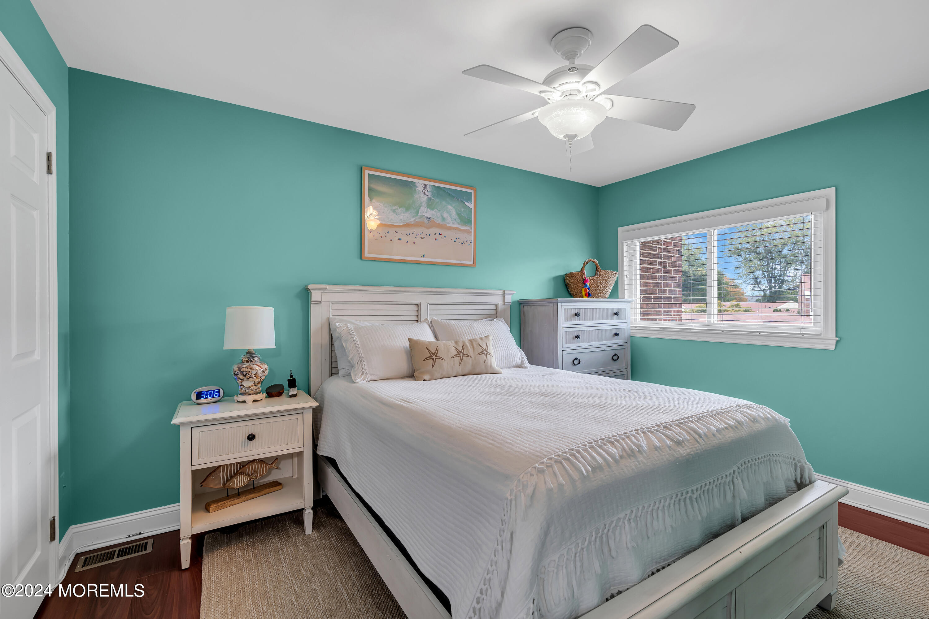 16 Spruce Lane Spring Lake Heights, NJ 07762 - Photo 23 of 31 a bedroom with a bed and a chandelier