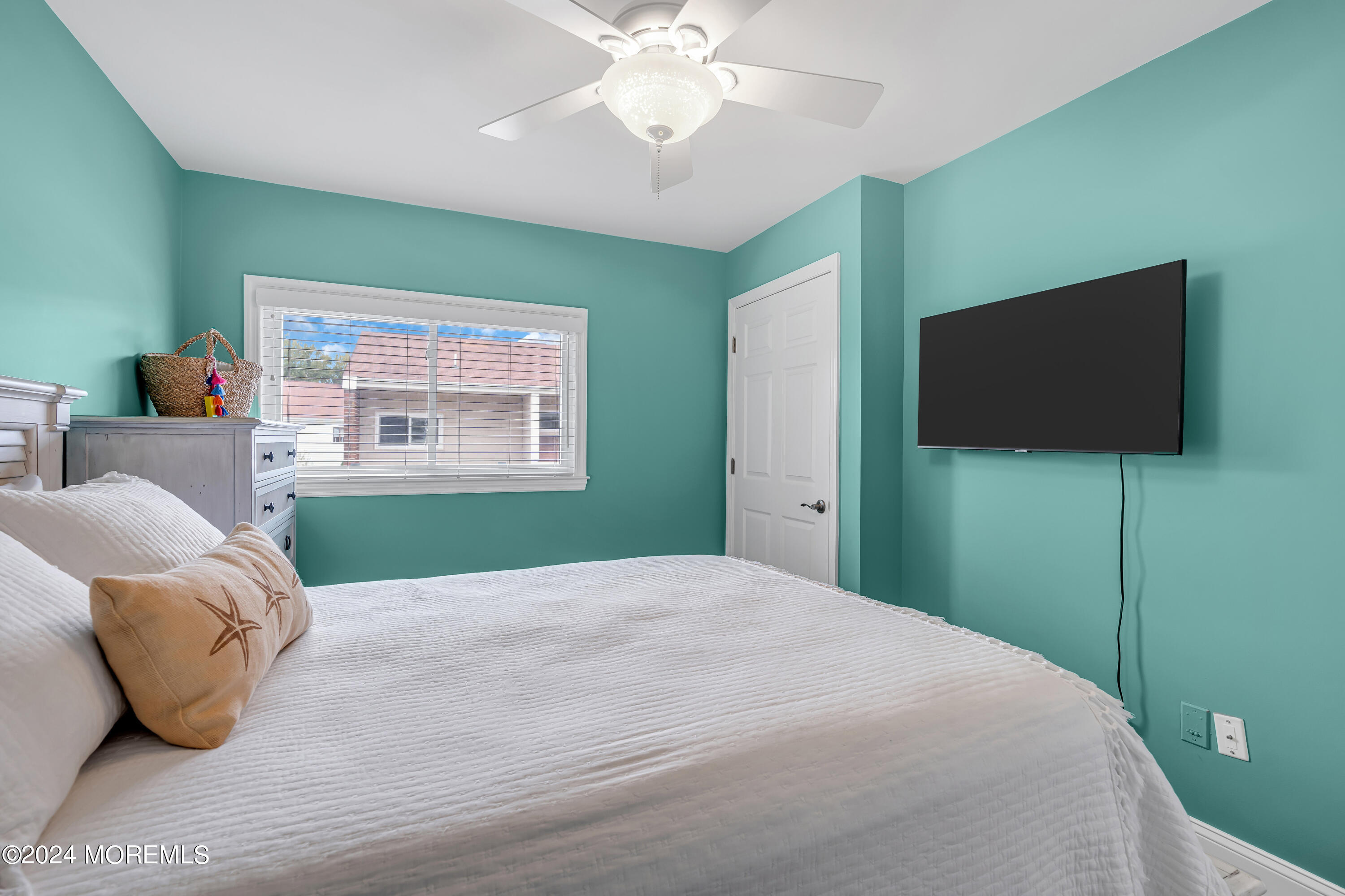 16 Spruce Lane Spring Lake Heights, NJ 07762 - Photo 24 of 31 a bedroom with a bed and a flat screen tv