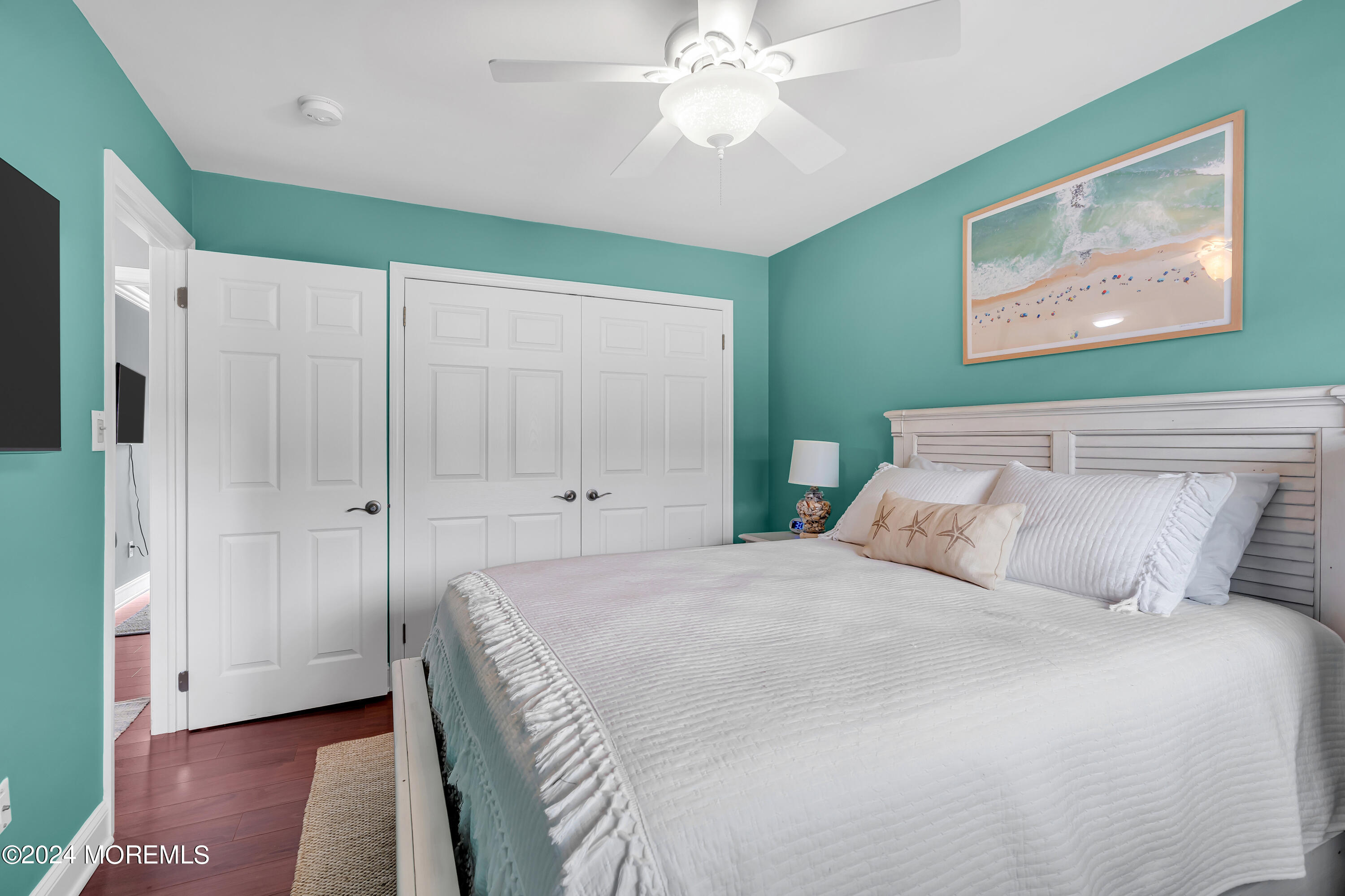 16 Spruce Lane Spring Lake Heights, NJ 07762 - Photo 25 of 31 a bedroom with a large bed and a chandelier
