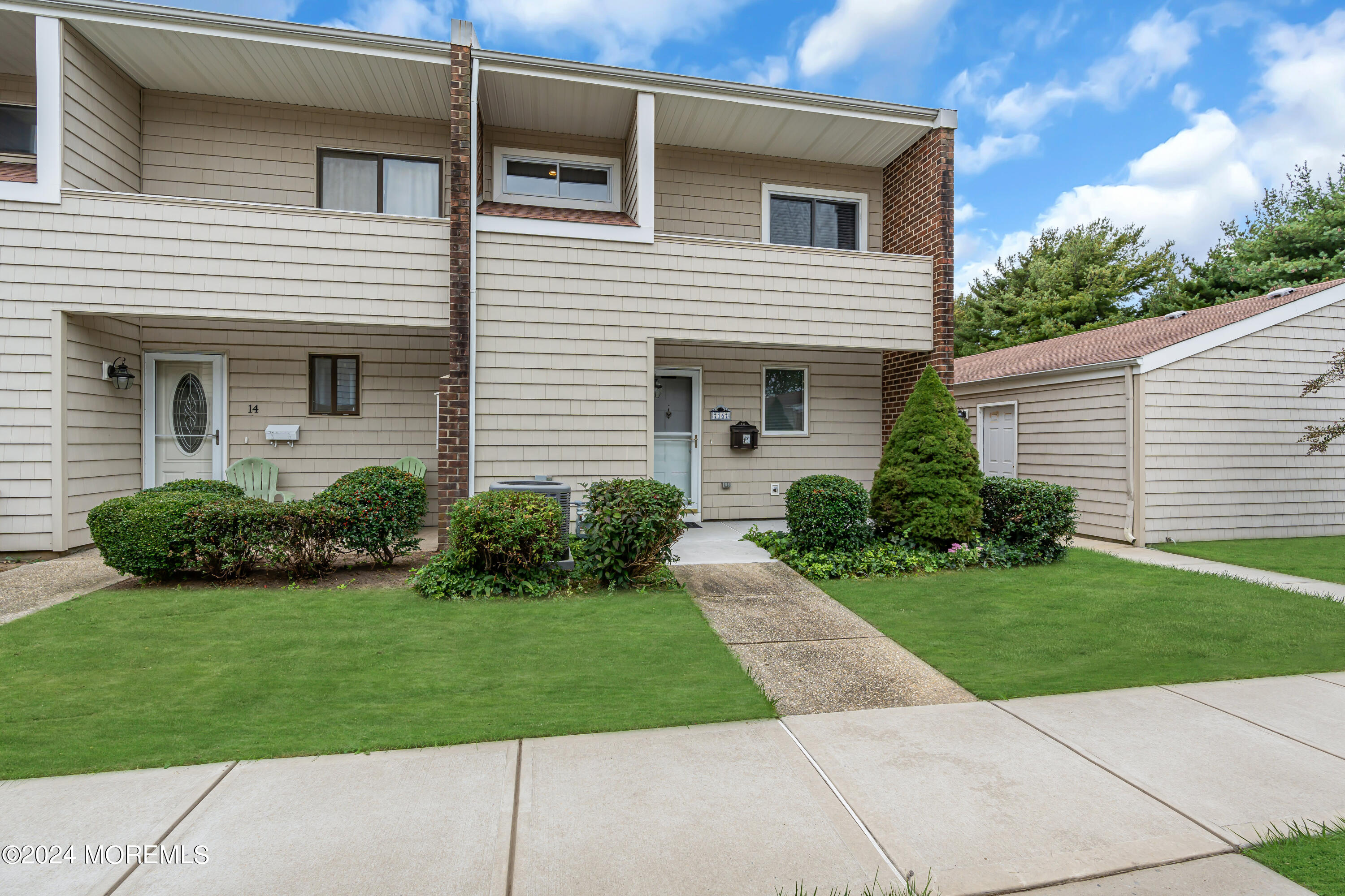 16 Spruce Lane Spring Lake Heights, NJ 07762 - Photo 3 of 31 a front view of a house with a yard