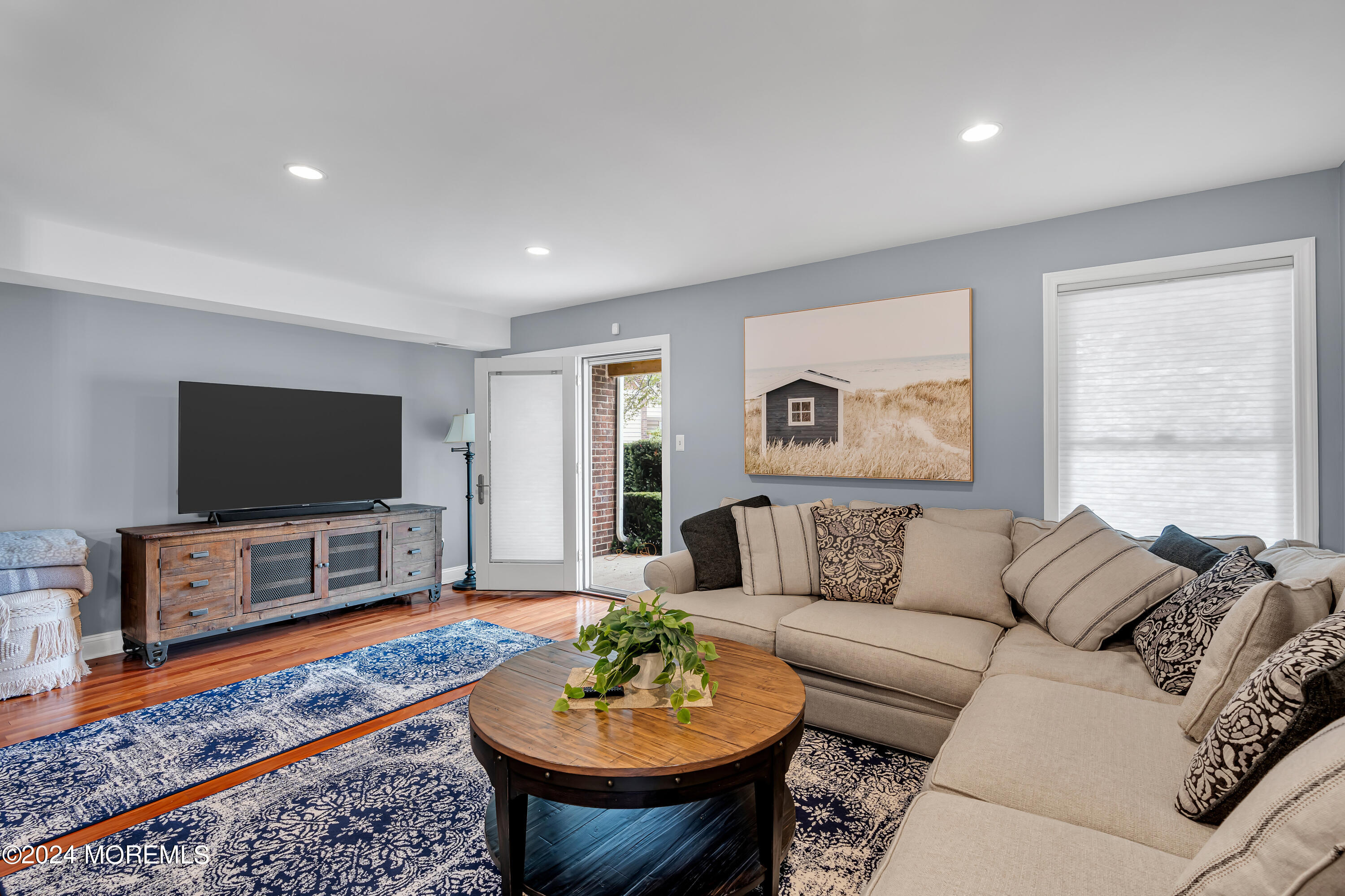 16 Spruce Lane Spring Lake Heights, NJ 07762 - Photo 6 of 31 a living room with furniture and a flat screen tv