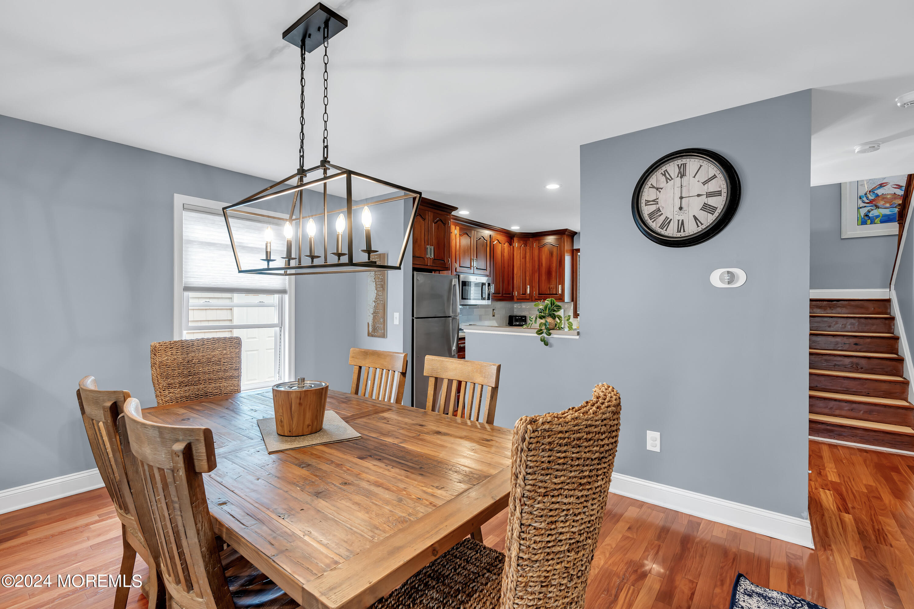 16 Spruce Lane Spring Lake Heights, NJ 07762 - Photo 9 of 31 a view of a dining room with furniture a chandelier and wooden floor