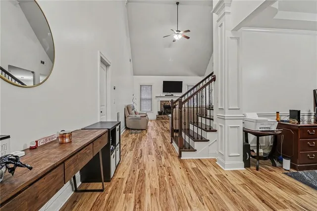 a view of a room with wooden floor and stairs