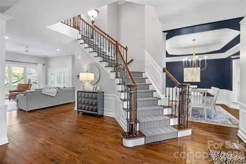 a view of entryway livingroom and hall with wooden floor