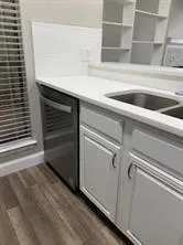 a close view of sink and cabinets