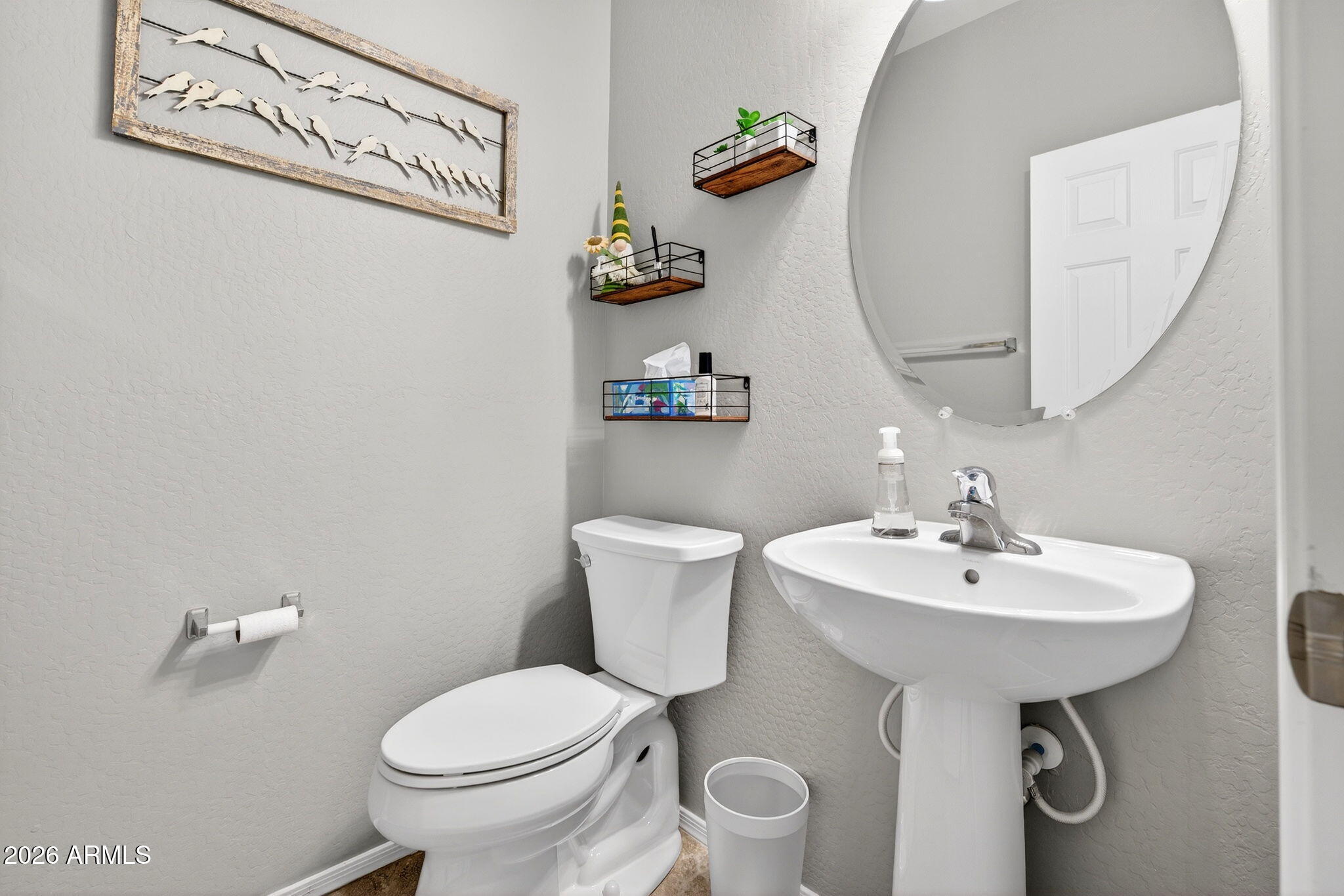 10840 West Saddlehorn Road Peoria, AZ 85383 - Photo 15 of 55 a bathroom with a sink toilet and a mirror