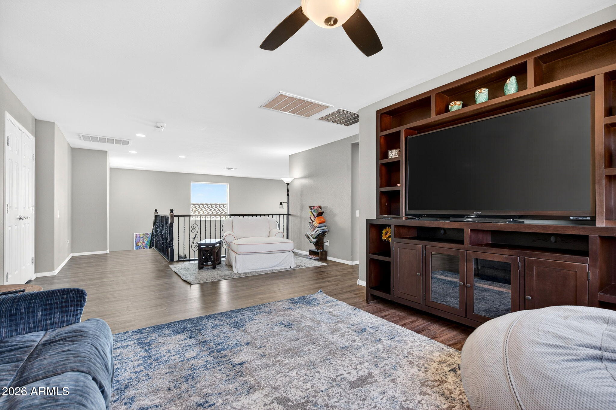 10840 West Saddlehorn Road Peoria, AZ 85383 - Photo 17 of 55 a living room with furniture and a flat screen tv
