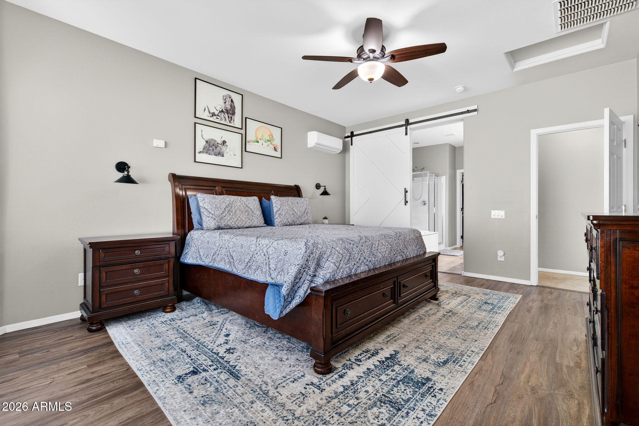 10840 West Saddlehorn Road Peoria, AZ 85383 - Photo 21 of 55 a bedroom with a bed chandelier and a window