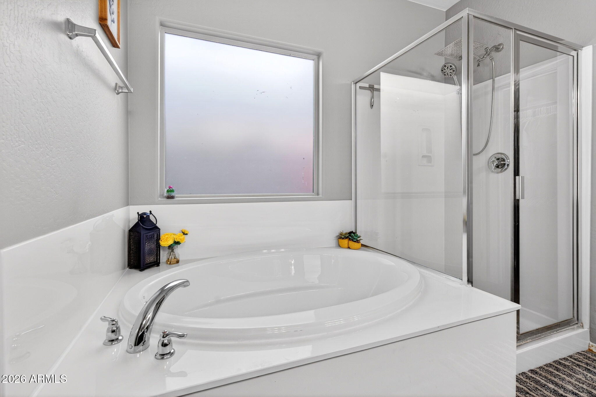 10840 West Saddlehorn Road Peoria, AZ 85383 - Photo 24 of 55 a bathroom with a bathtub and a shower