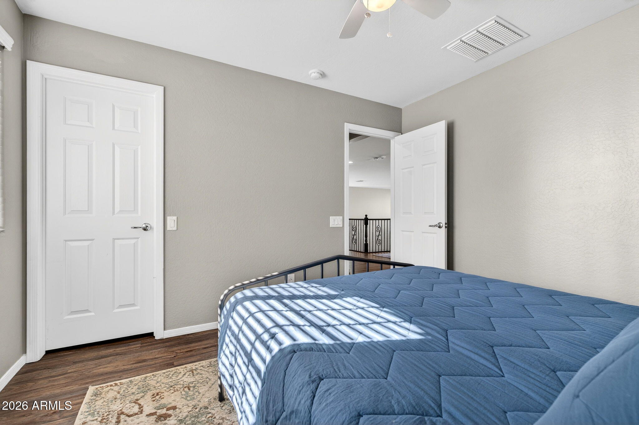 10840 West Saddlehorn Road Peoria, AZ 85383 - Photo 26 of 55 a bedroom with a bed and a dresser