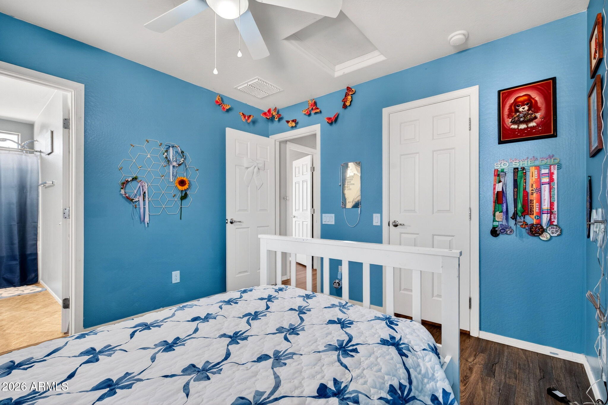 10840 West Saddlehorn Road Peoria, AZ 85383 - Photo 29 of 55 a bedroom with bed and paintings on the wall