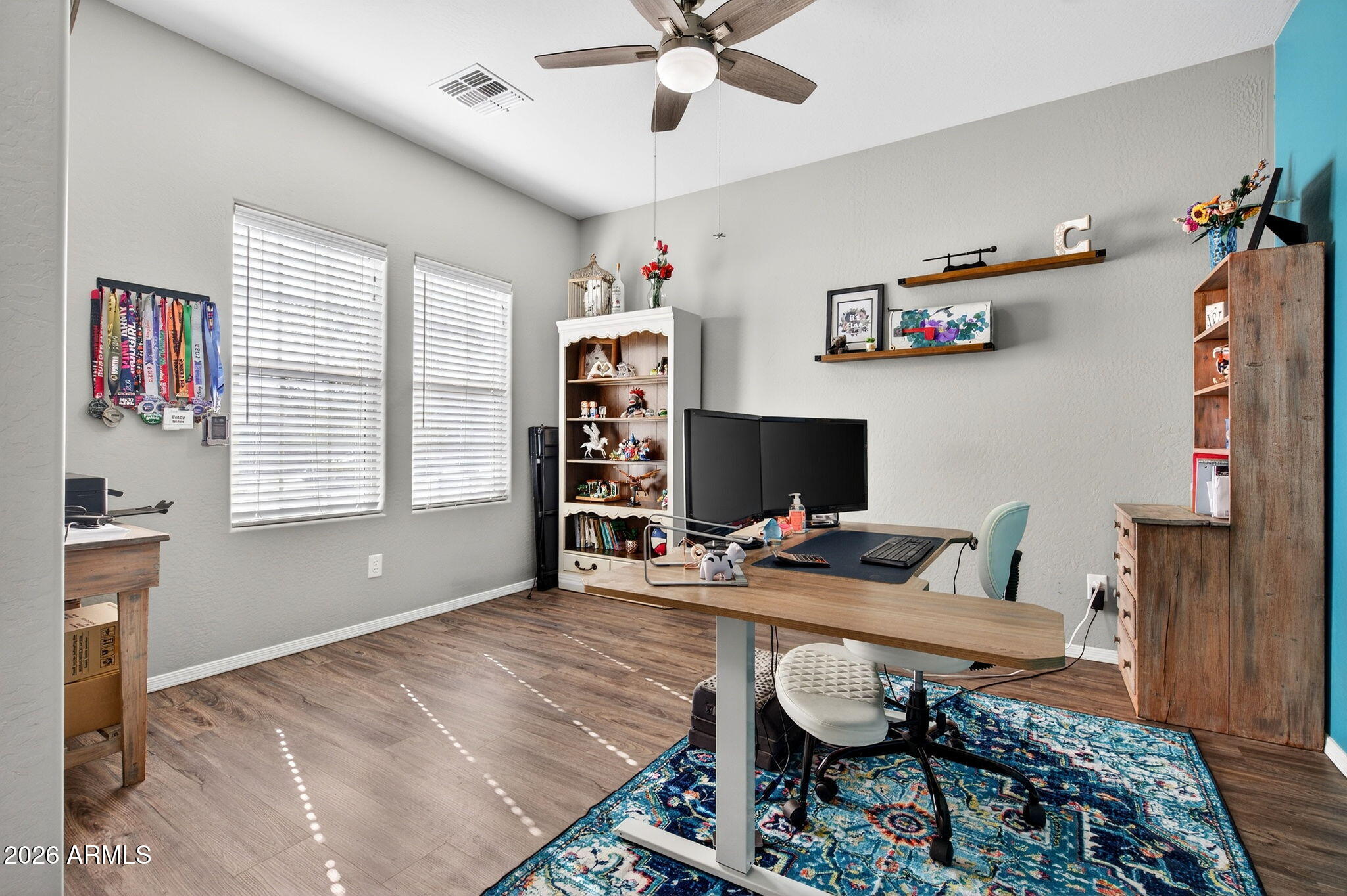 10840 West Saddlehorn Road Peoria, AZ 85383 - Photo 34 of 55 a workspace with furniture and window