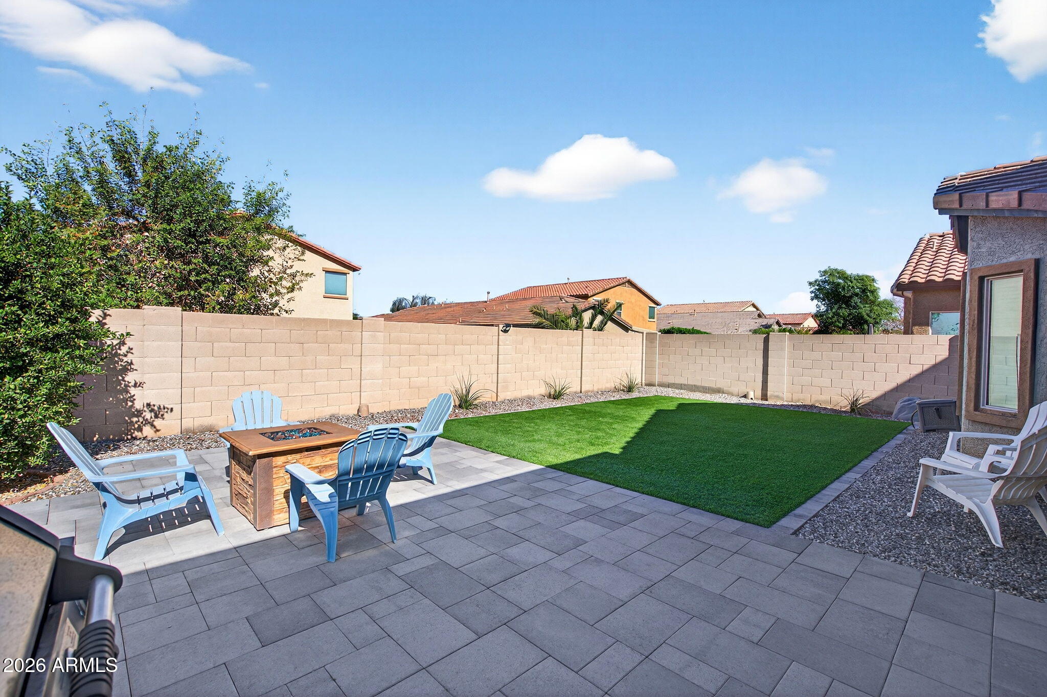 10840 West Saddlehorn Road Peoria, AZ 85383 - Photo 37 of 55 a view of a backyard with furniture and a garden
