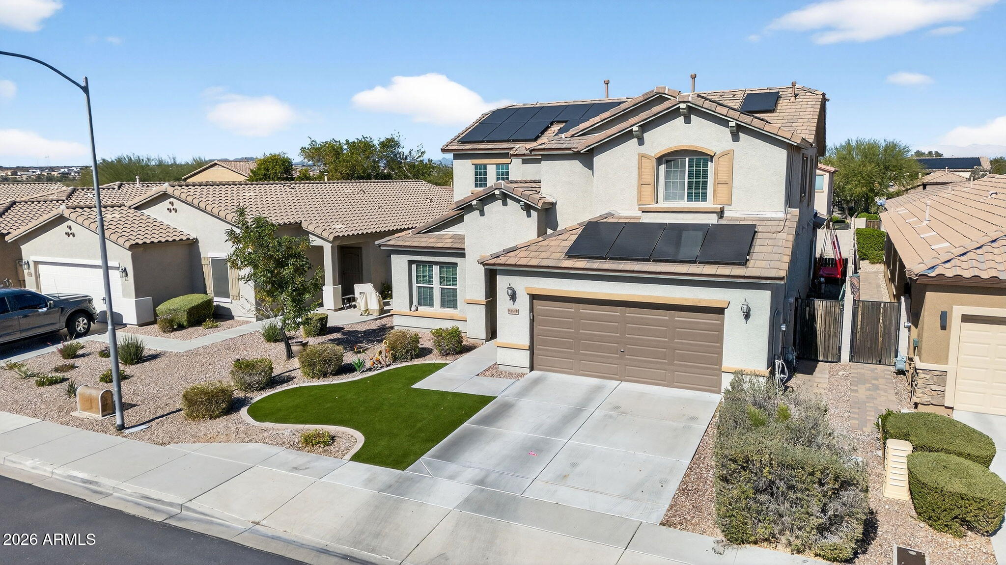 10840 West Saddlehorn Road Peoria, AZ 85383 - Photo 50 of 55 a front view of a house with garden