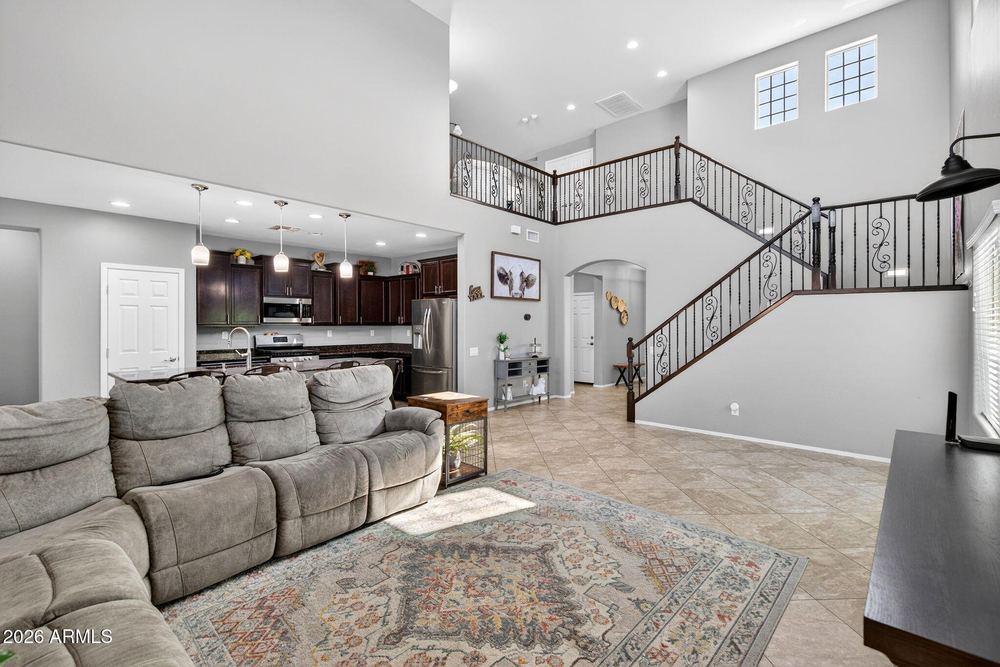 10840 West Saddlehorn Road Peoria, AZ 85383 - Photo 6 of 55 a living room with furniture and a wooden floor