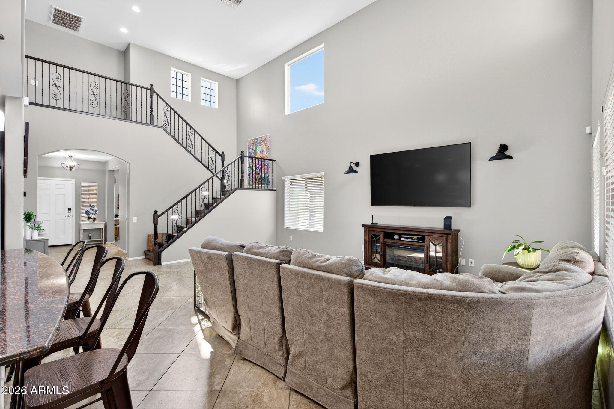 10840 West Saddlehorn Road Peoria, AZ 85383 - Photo 7 of 55 a living room with furniture and a flat screen tv