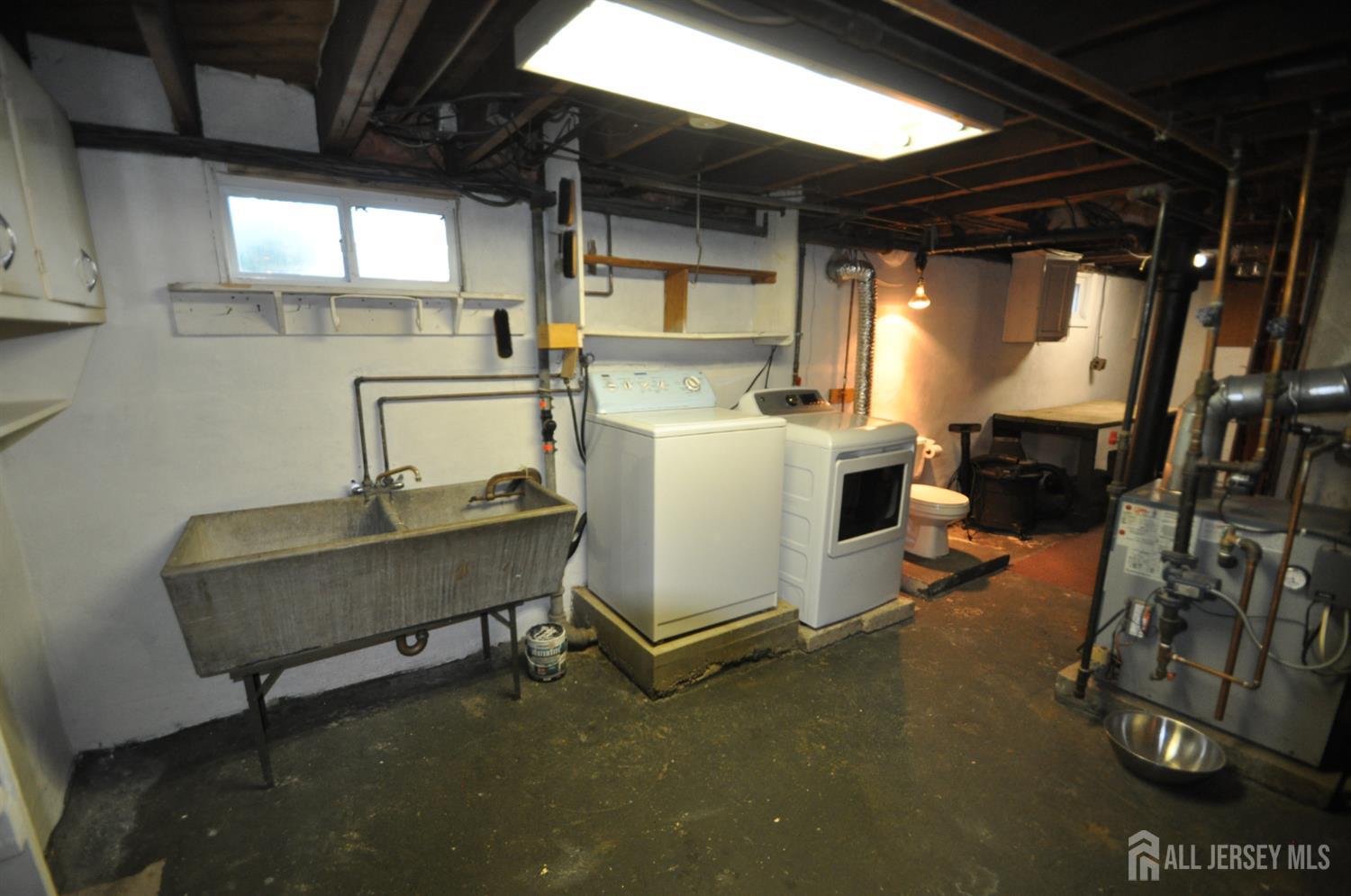 213 Old Post Road Edison, NJ 08817 - Photo 17 of 18 a room with storage and utility