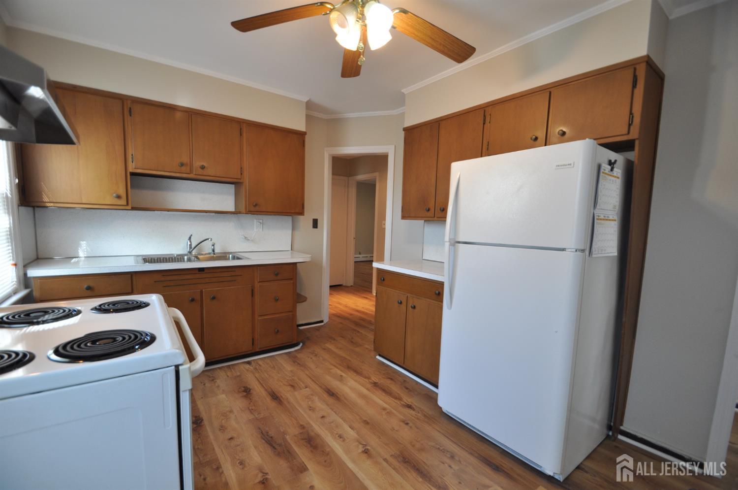 213 Old Post Road Edison, NJ 08817 - Photo 8 of 18 a kitchen with a refrigerator a stove top oven a sink and dishwasher