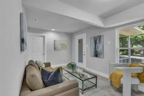 a living room with furniture and a window