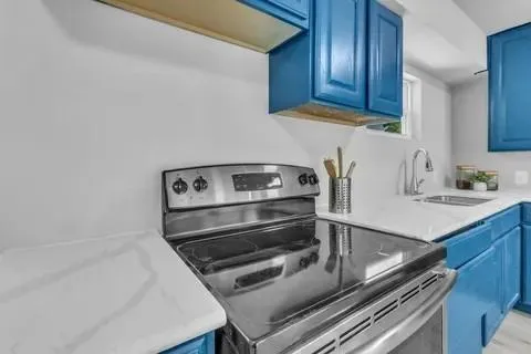 a kitchen with a stove and a sink