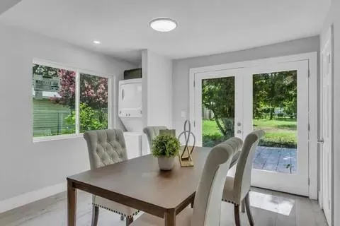 a view of a dining room with furniture window and outside view