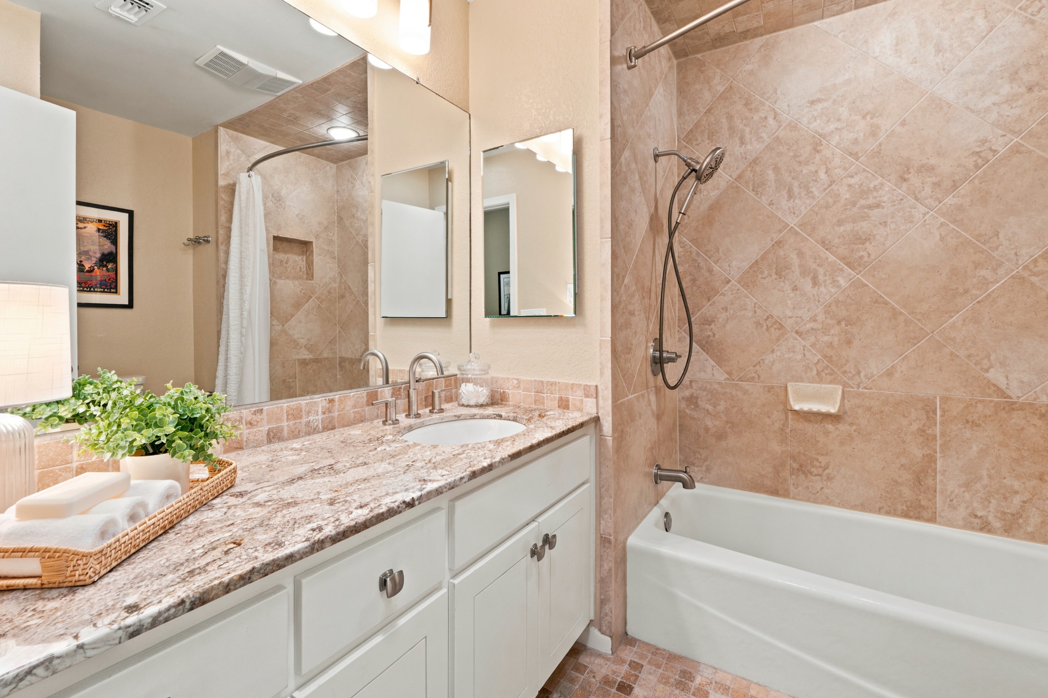 1904 Stoneridge Road Austin, TX 78746 - Photo 26 of 40 Hall bath features updated finishes, granite countertops and a tub/shower combination.