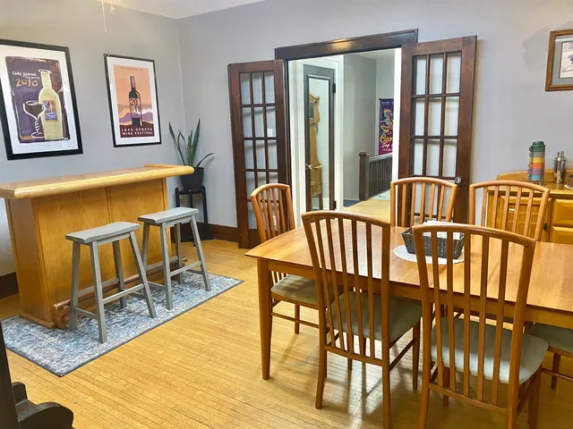 a view of a dining room with furniture and wooden floor