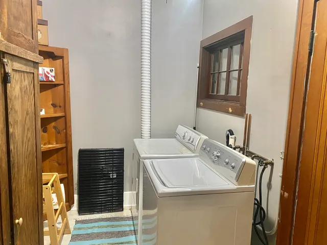 a kitchen with a refrigerator and a sink