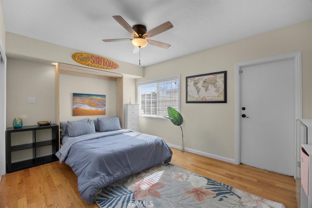 2407 Ripley Avenue Redondo Beach, CA 90278 - Photo 11 of 39 a bedroom with a bed and a chandelier