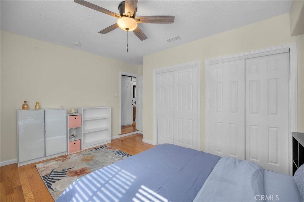 2407 Ripley Avenue Redondo Beach, CA 90278 - Photo 13 of 39 a bedroom with a bed and a chandelier