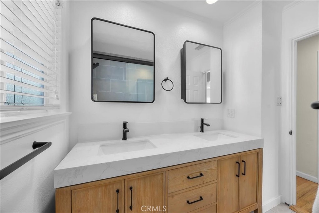 2407 Ripley Avenue Redondo Beach, CA 90278 - Photo 15 of 39 a bathroom with a sink and a mirror